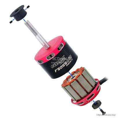 Exploded view of brushless motor showing rotor can, stator core, shaft and retaining hardware