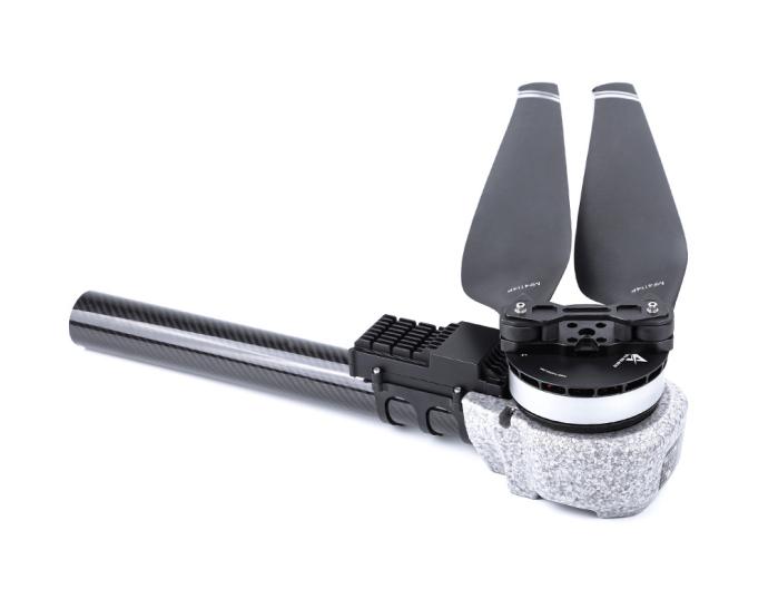 T-Motor UAV motor with two-blade propeller mounted on a carbon fiber arm, close-up on a white background