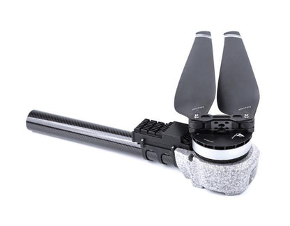 T-Motor UAV motor with two-blade propeller mounted on a carbon fiber arm, close-up on a white background