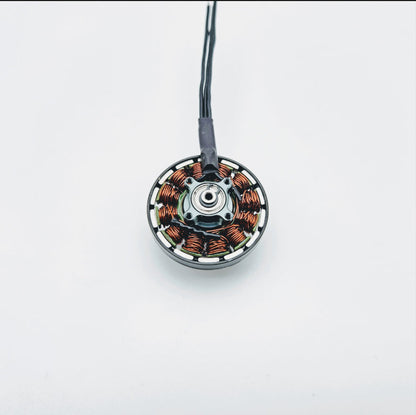 T-Motor brushless drone motor with exposed copper windings and three-wire lead on a white background