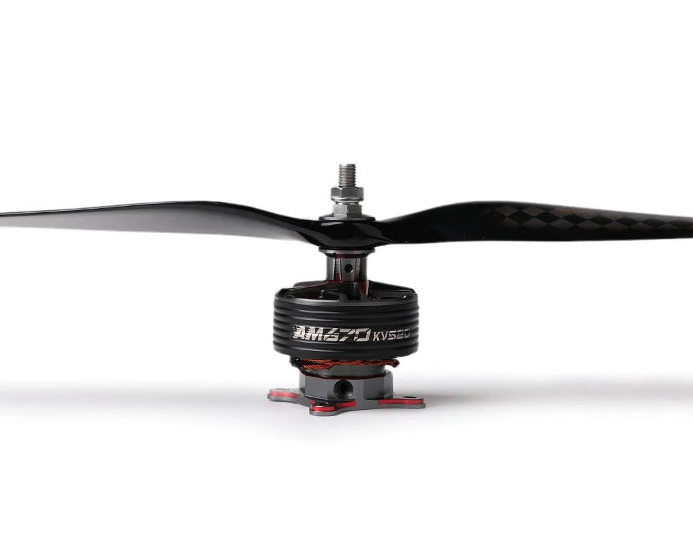 Close-up of a T-Motor brushless drone motor with a two-blade carbon fiber propeller installed