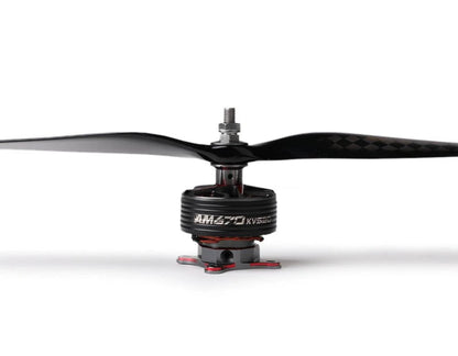 Close-up of a T-Motor brushless drone motor with a two-blade carbon fiber propeller installed