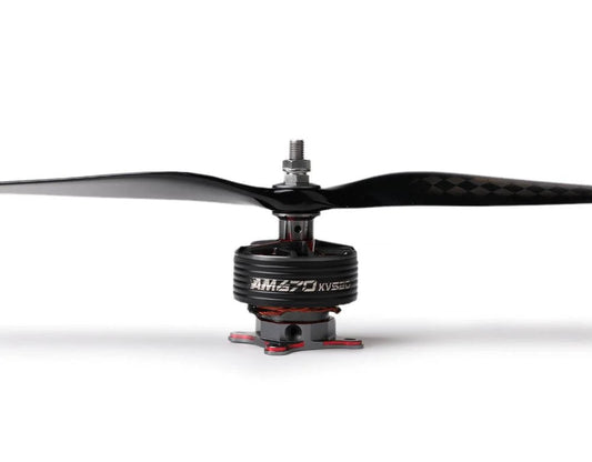 Close-up of a T-Motor brushless drone motor with a two-blade carbon fiber propeller installed