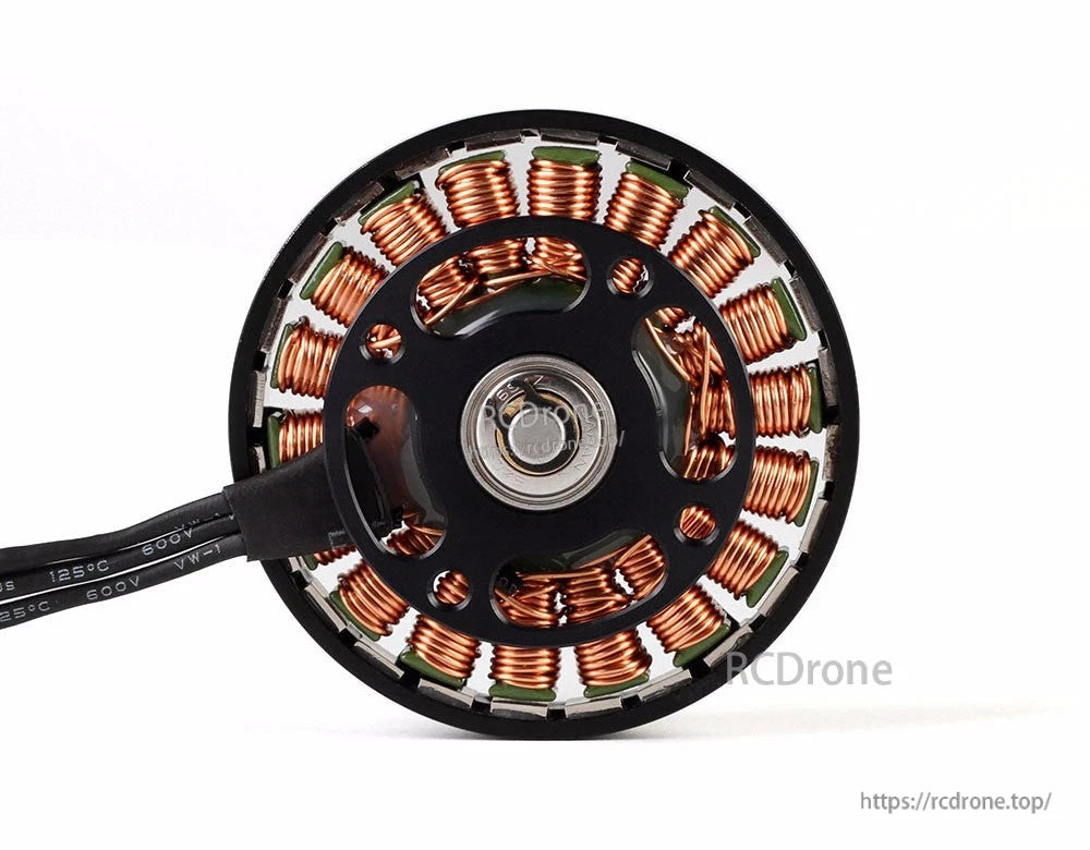 T-Motor brushless outrunner motor close-up with copper windings, central bearing, and attached power leads
