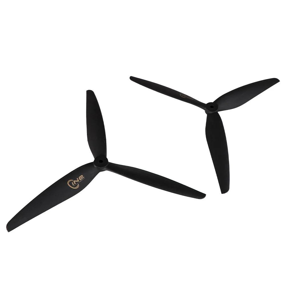 T-Motor CINE 3-Blade FPV Propeller, Two black T-Motor CINE 3-blade FPV drone propellers with central mounting hub on a white background