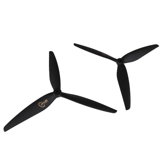 T-Motor CINE 3-Blade FPV Propeller, Two black T-Motor CINE 3-blade FPV drone propellers with central mounting hub on a white background
