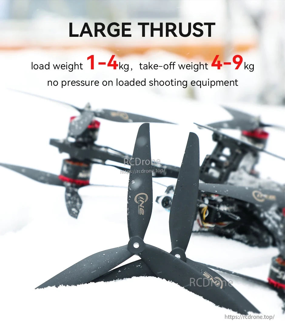 Black T-Motor CINE 3-blade FPV propellers with center mounting hole, photographed in front of a quadcopter