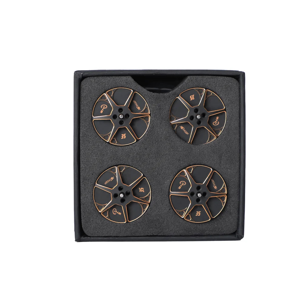 Set of four T-Motor black and copper motor bell tops packed in a foam-lined box