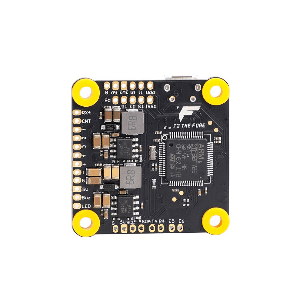 T-Motor F7 HD flight controller board with STM32F722 chip, labeled solder pads, and four yellow mounting grommets