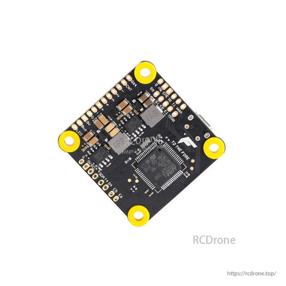 T-Motor F7 HD flight controller board with four yellow mounting grommets and labeled solder pads