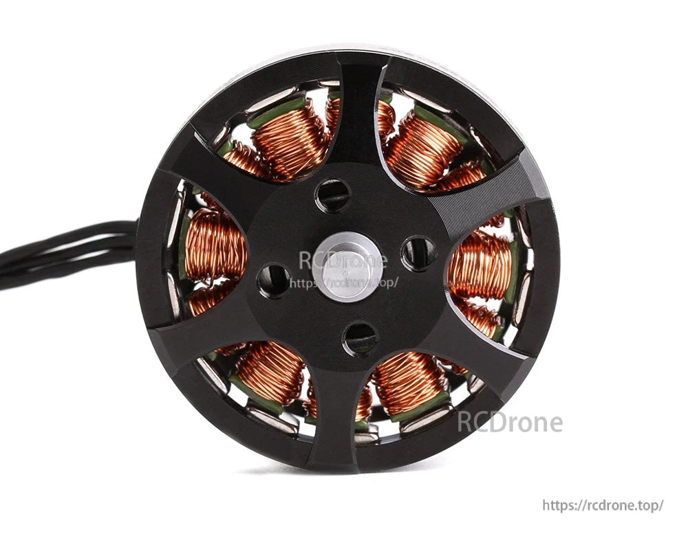 Top view of a T-Motor brushless drone motor with black rotor bell, copper windings, and power leads