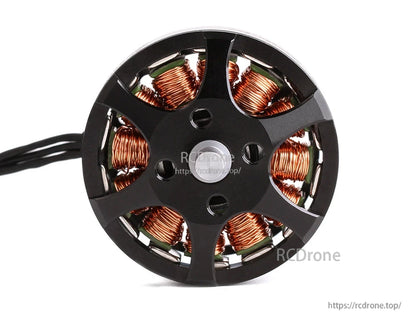 Top view of a T-Motor brushless drone motor with black rotor bell, copper windings, and power leads