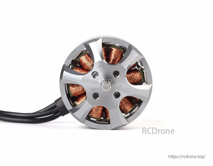 Top view of a T-Motor brushless drone motor with silver bell, exposed copper windings, and mounting holes