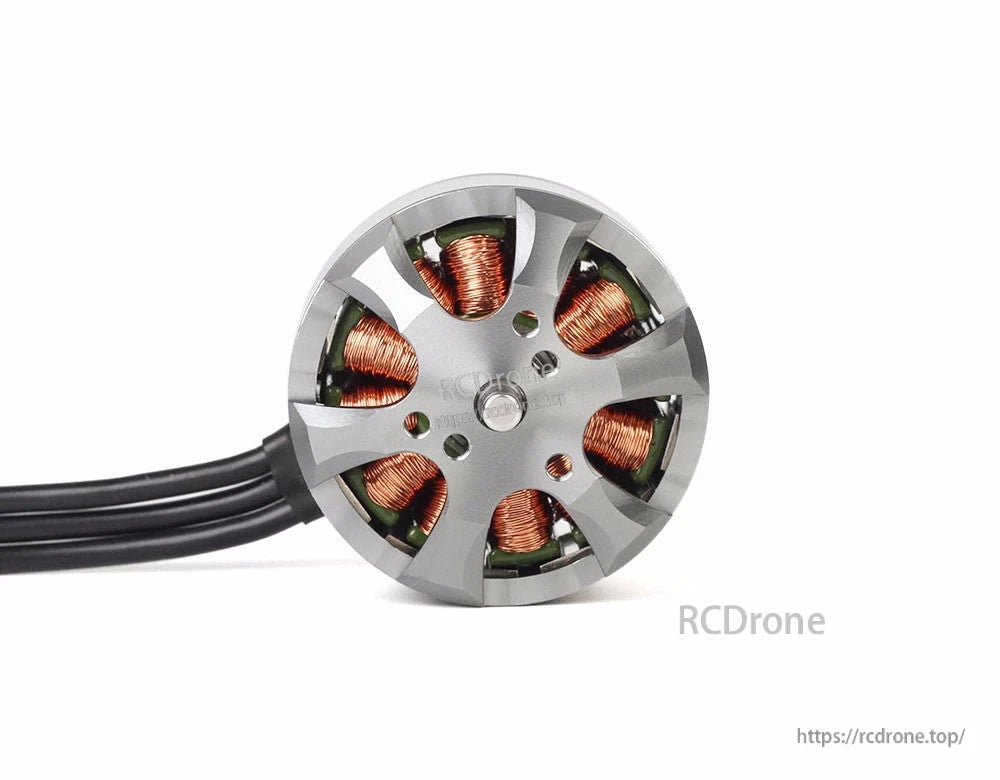 T-Motor brushless drone motor close-up with exposed copper windings, gray aluminum bell, and three power wires