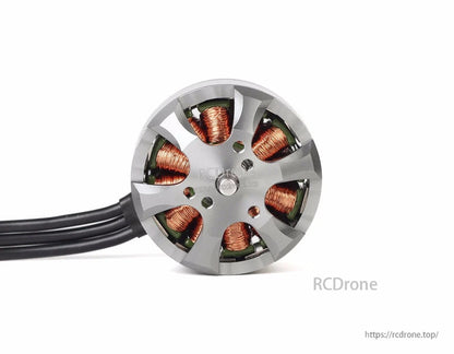 Close-up of T-Motor brushless outrunner drone motor with exposed copper windings and three-phase wires