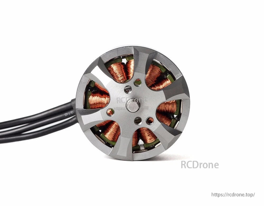 T-Motor brushless drone motor close-up with gray bell housing, visible copper windings, and three black wires