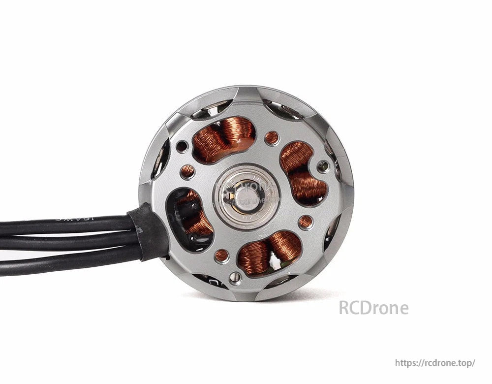Rear view of T-Motor brushless drone motor with exposed copper windings, bearing center, and three lead wires