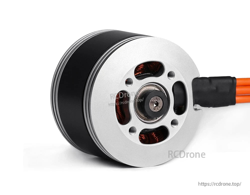 Close-up of a T-Motor brushless outrunner motor with silver endplate, mounting holes, and orange wires