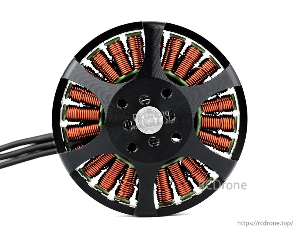 Close-up of a T-Motor brushless drone motor showing copper windings, central hub mounting holes, and power leads