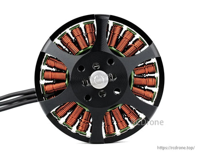 Top view of a T-Motor brushless drone motor with exposed copper windings, mounting holes, and lead wires