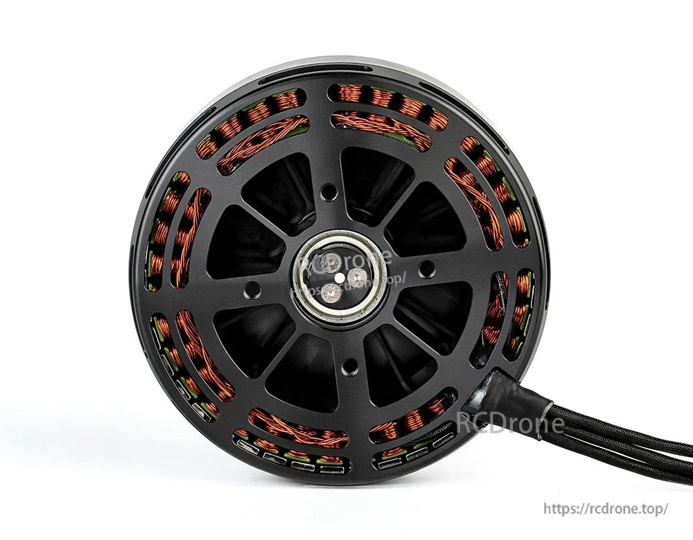 Bottom view of a black T-Motor brushless drone motor with exposed copper windings and braided power cable