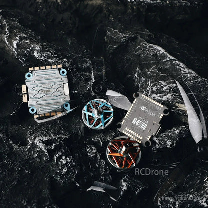 T-Motor Pacer Alpha G4 flight controller board alongside FPV drone motors and propellers on a dark surface