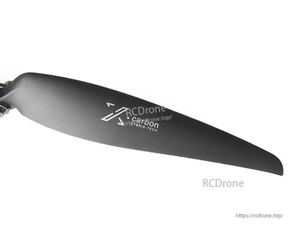 Black folding fixed-wing propeller blade with carbon hybrid-tech marking and rotation direction arrow