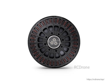 Top view of a T-Motor round black housing with radial spokes, visible copper windings, and a central mounting hub