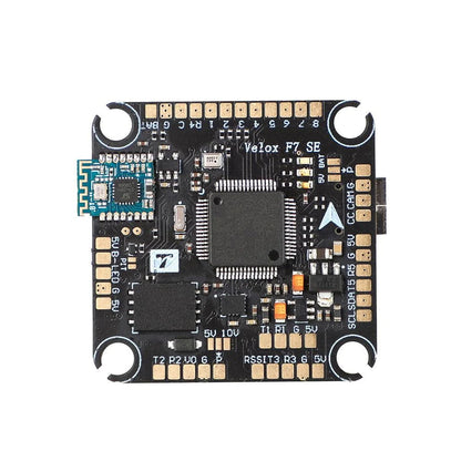 T-Motor Velox F7 SE flight controller board with integrated Bluetooth module and labeled solder pads