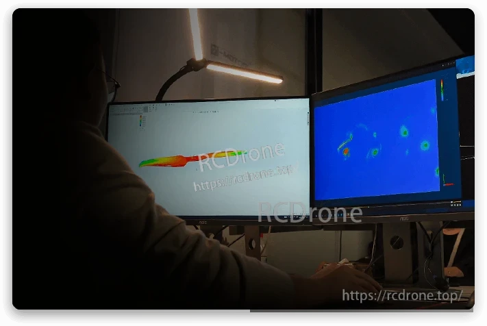 T-Motor VZ20x8.2 20in VTOL Propeller, Engineer running airflow simulation on dual monitors to analyze VTOL propeller blade design and wake patterns