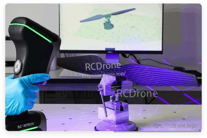Carbon fiber VTOL drone propeller mounted on a fixture during 3D scanning inspection with a handheld scanner