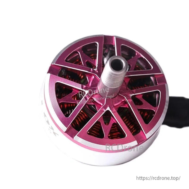 T-Motor brushless outrunner motor with purple anodized top cover, exposed copper windings, and central shaft