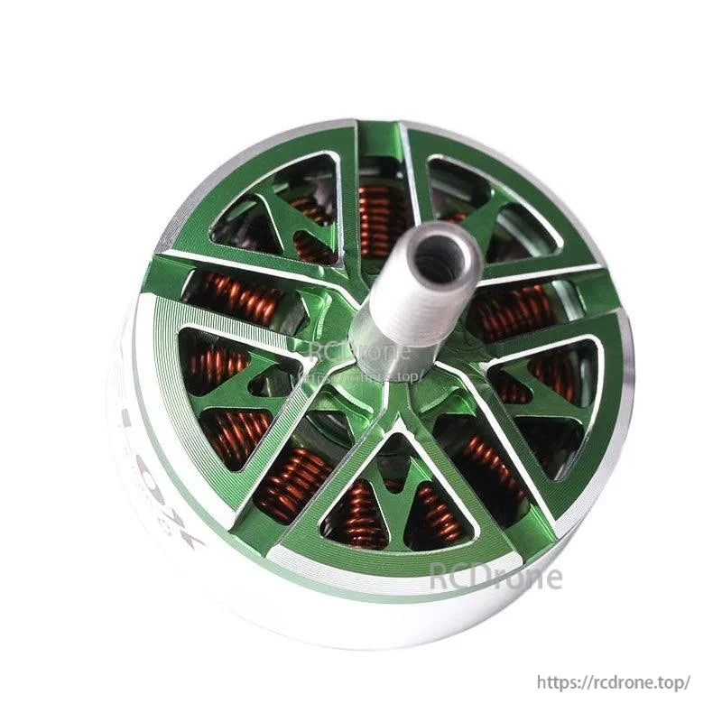 Top view of a T-Motor brushless motor with green machined aluminum bell, copper windings, and center shaft
