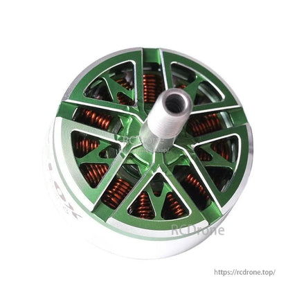Top view of a T-Motor brushless motor with green machined aluminum bell, copper windings, and center shaft