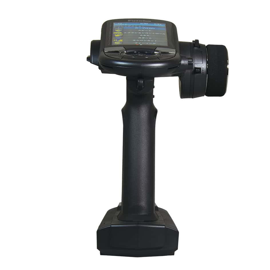 T6PV surface RC transmitter front view showing LCD menu screen, grip and steering wheel