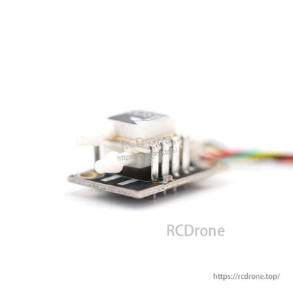 Side view of the airspeed sensor board showing pressure ports, sensor module, and cable connector