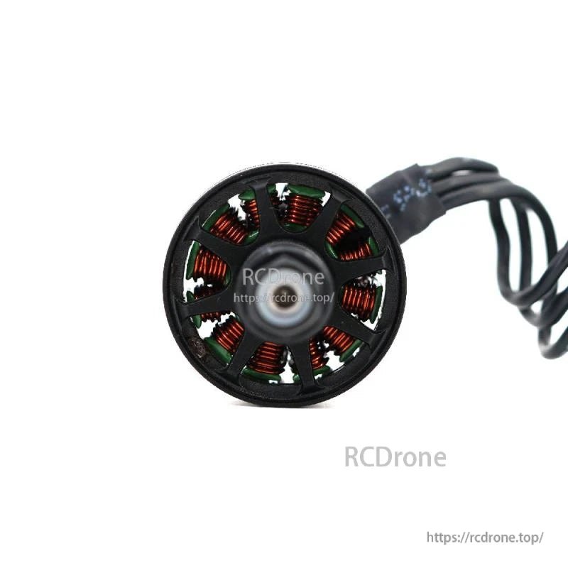 Close-up rear view of brushless motor stator with copper windings and black cable