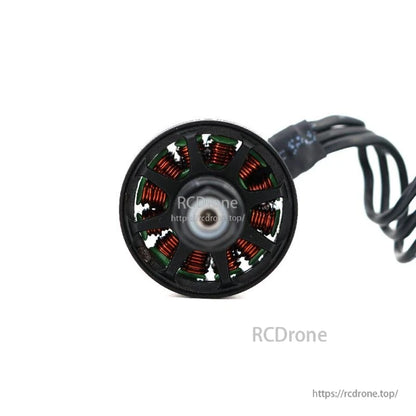 Close-up rear view of brushless motor stator with copper windings and black cable