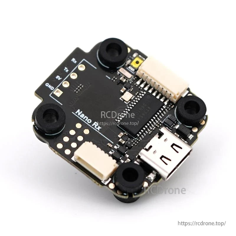 Flight controller angled top view with USB port, connectors, and mounting grommets