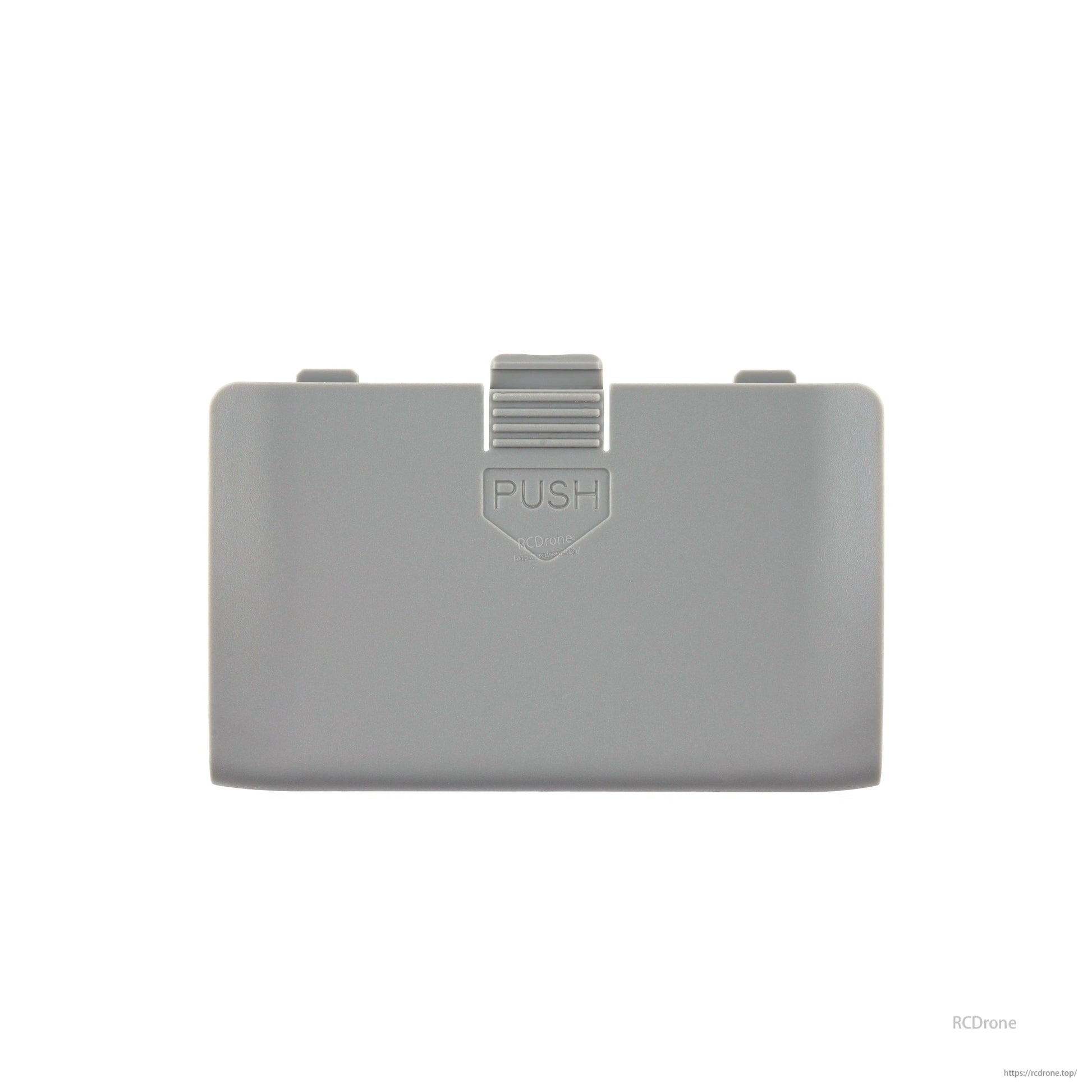 TX15 radio battery cover in gray with 'PUSH' latch tab, straight-on front view