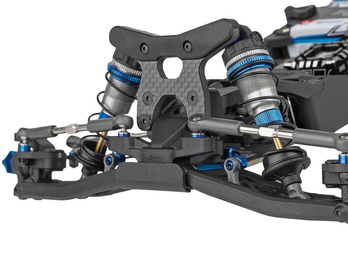 Close-up of Team Associated RC10B7.1 1/10 2WD buggy front suspension with aluminum shocks and carbon shock tower