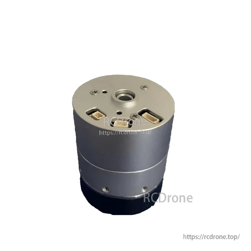 Top end view with center bore and two rectangular connector ports on the joint module housing