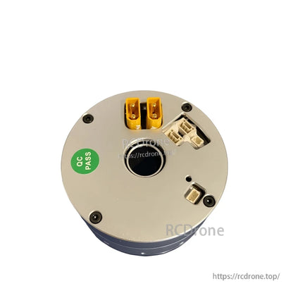 Close-up of connector plate with two yellow power connectors, multiple white sockets, and center opening