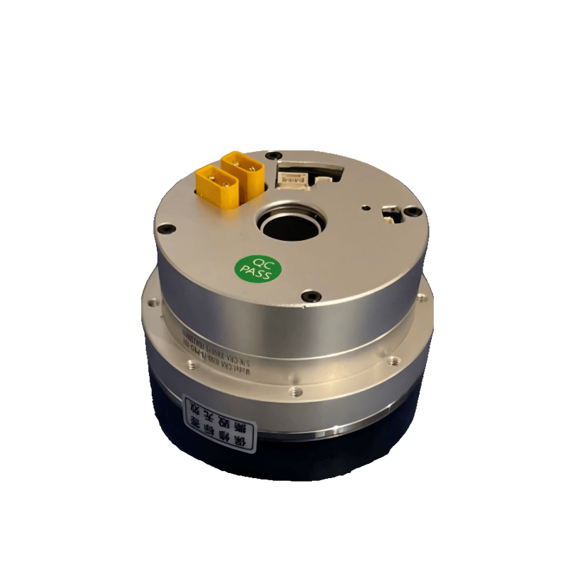 Angled top view showing dual yellow power plugs, center shaft opening, and access cutouts on housing