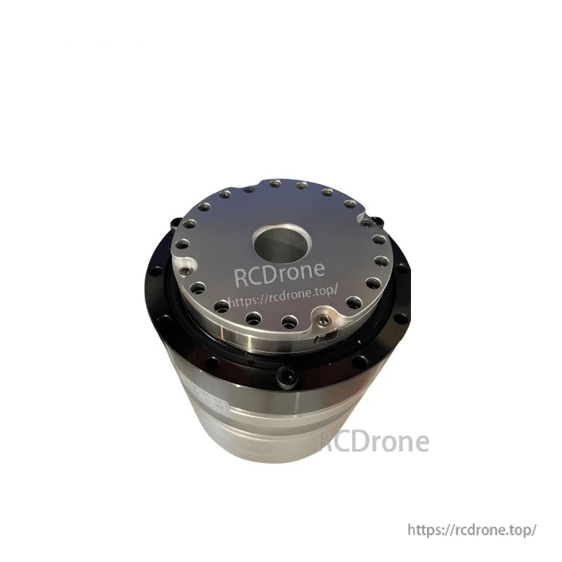 Output flange close-up with evenly spaced mounting holes and recessed center opening