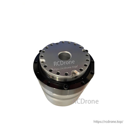 Output flange close-up with evenly spaced mounting holes and recessed center opening