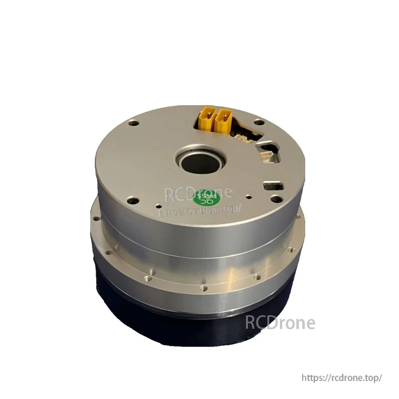 Angled view of motor joint module showing top face, center bore, and yellow power connector block