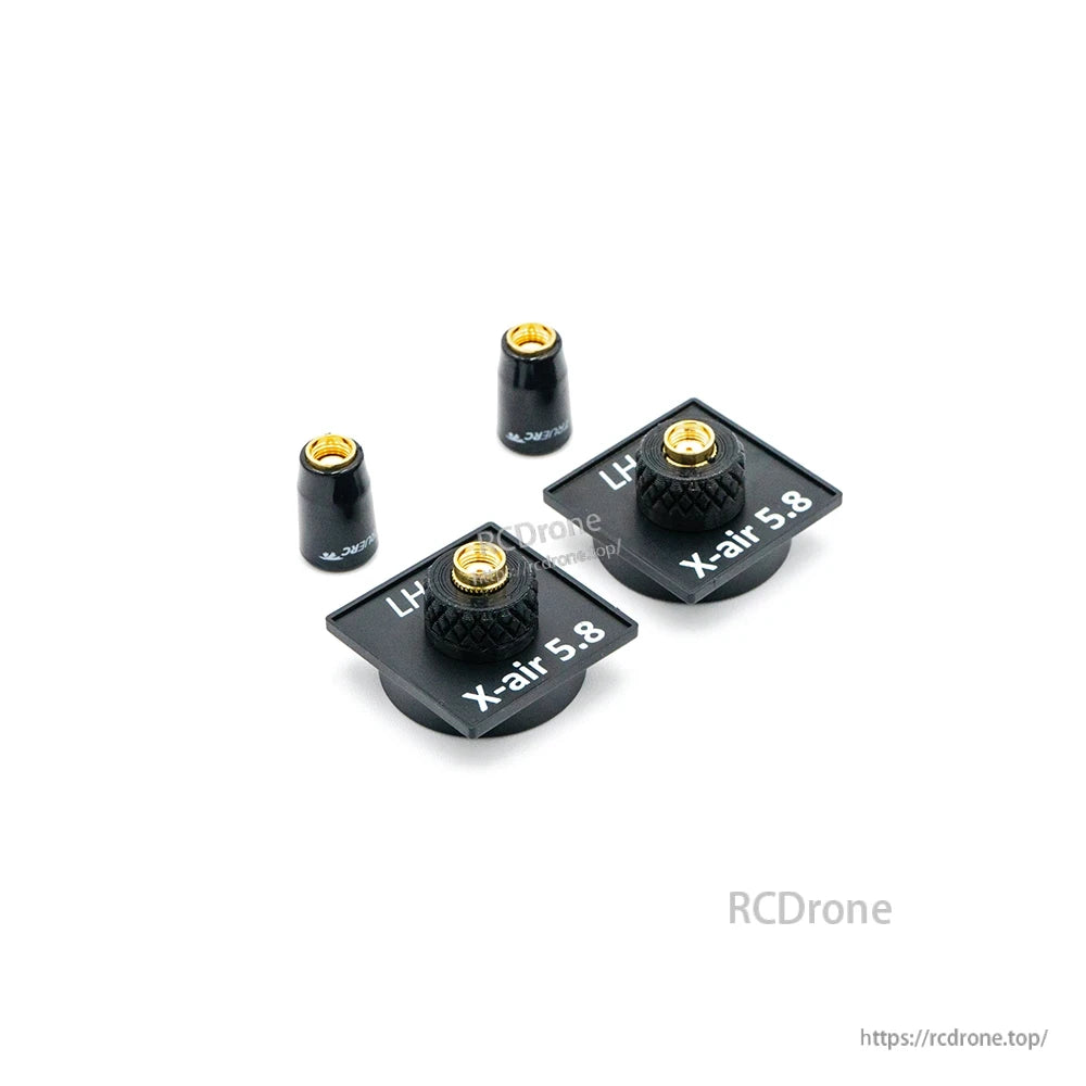 X-Air 5.8 antenna plates and matching stubby antennas, angled view with threaded connectors visible