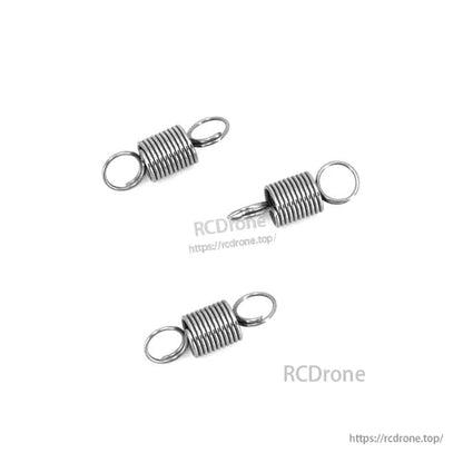 Three metal gimbal tension springs shown with RCDrone watermark and website URL overlay
