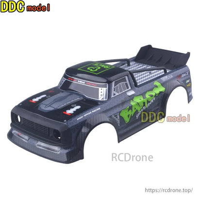 RC car body shell with green and black design.